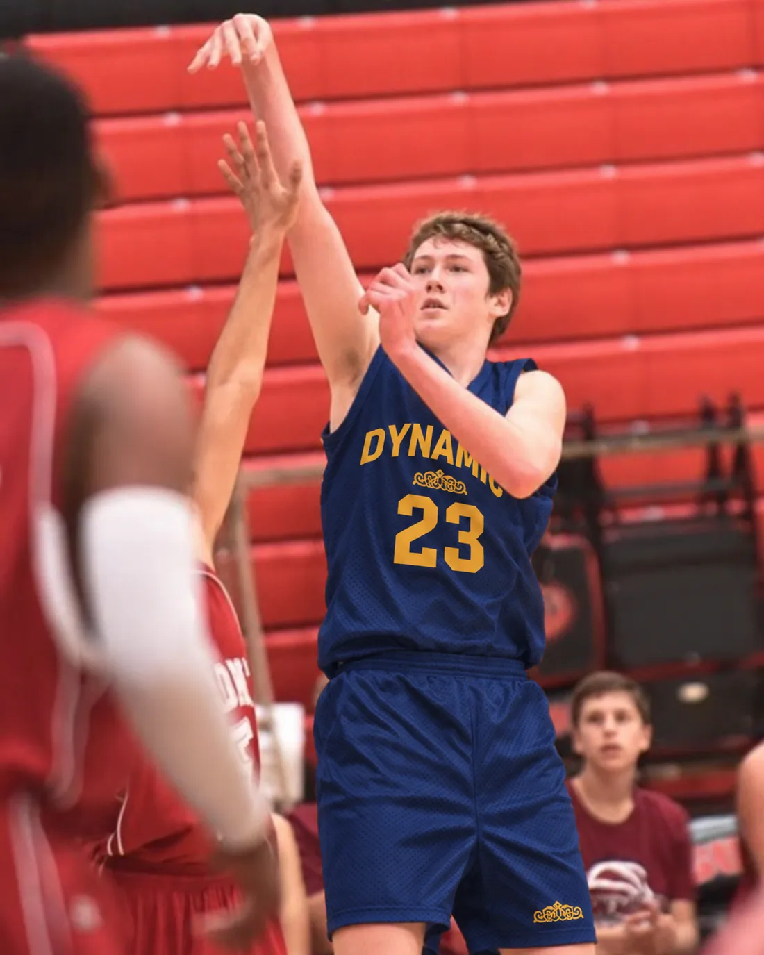 Teen player taking a jump shot